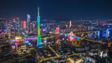 Aerial view of Guangzhou skyline at night with Canton Tower, vibrant city lights, and Pearl River; part of 30-day China panoramic tour.